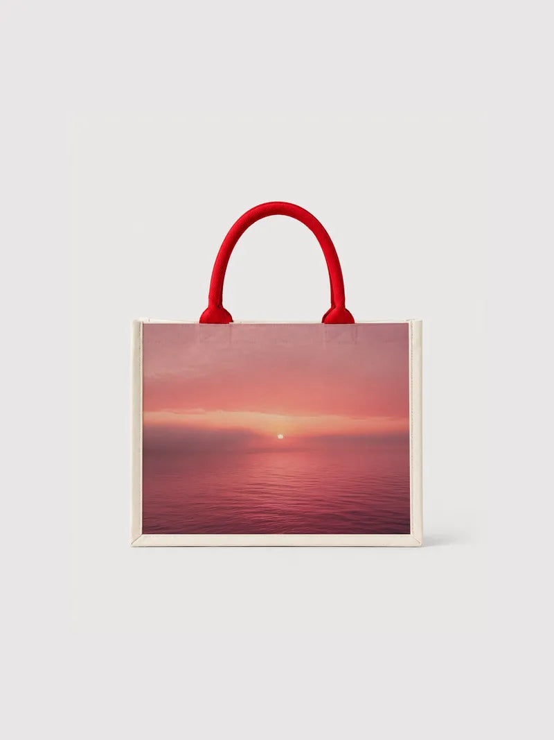 Fog and pink sky over the ocean Canvas Bag